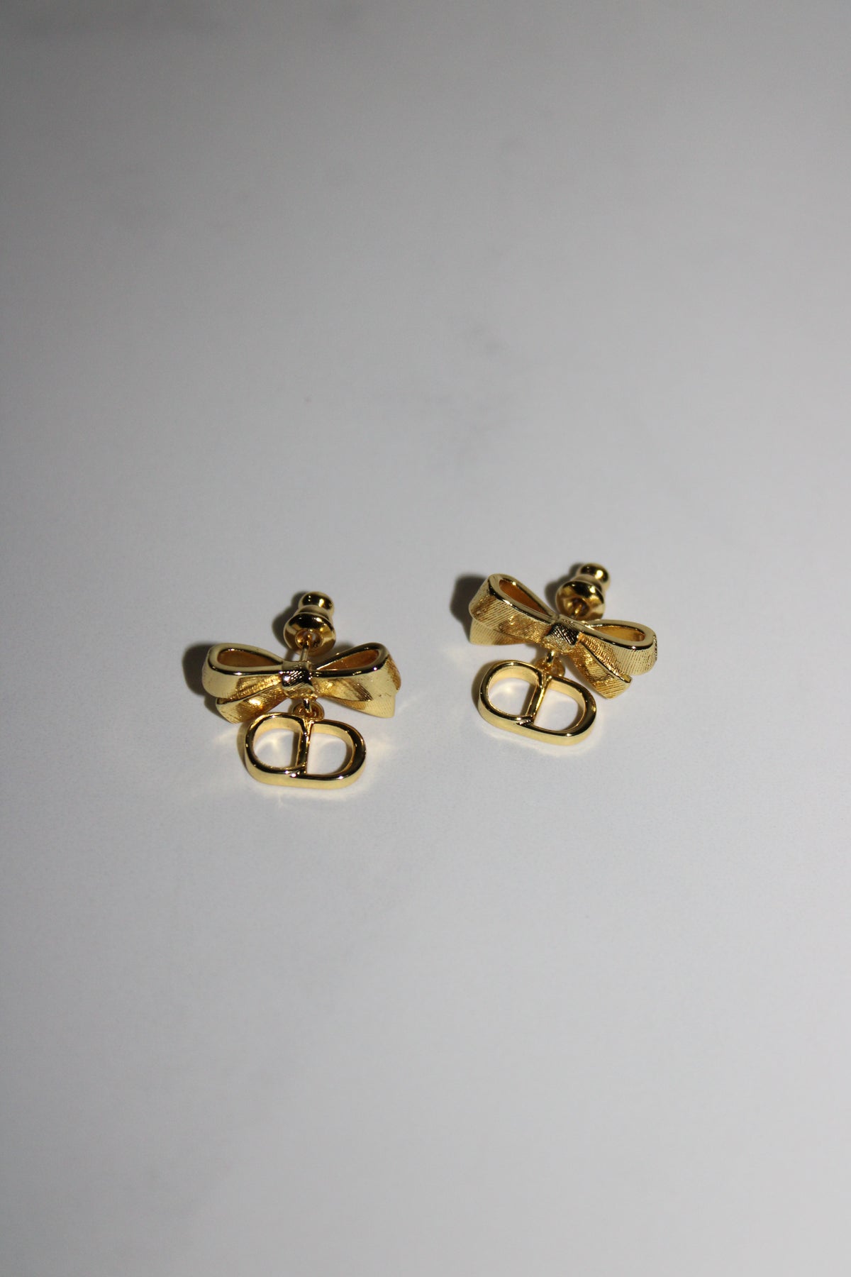 Aretes Cd moño